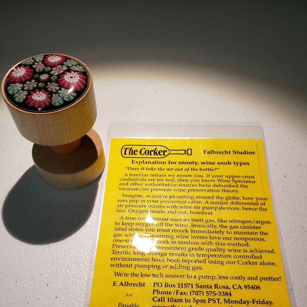 NEW NEVER USED. THE CORKER A reusable cork for many kinds of bottles,wine,liquor